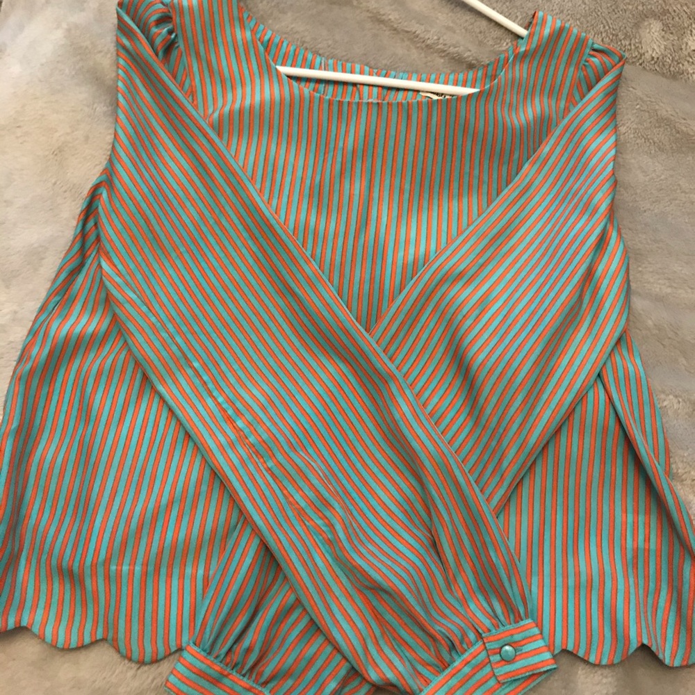 Orange/blue blouse . Scalloped bottom